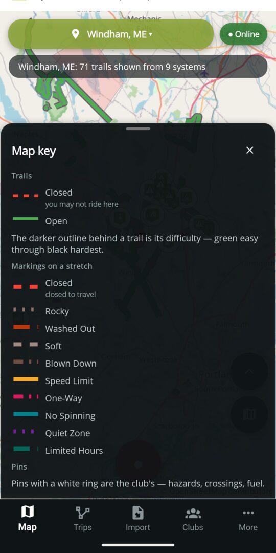 The map key open over the Windham trail map: closed trails dashed red, open green, and each marking type with its own colour and stroke